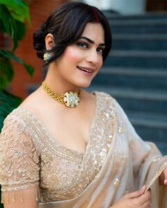 Sexy beautiful Indian bhabhi in golden embroidered saree