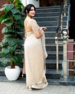 Sexy Indian desi bhabhi photo in golden saree posing outdoors