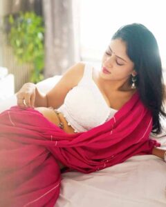 Sexy desi bhabhi in pink saree with white blouse showing elegant back pose