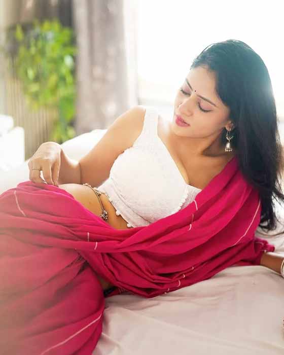 Sexy desi bhabhi in pink saree with white blouse showing elegant back pose