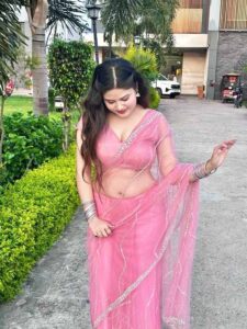 Indian sexy bhabhi in pink saree showing elegant desi charm