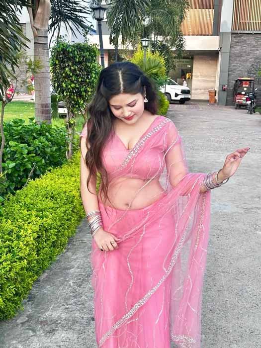 Indian sexy bhabhi in pink saree showing elegant desi charm