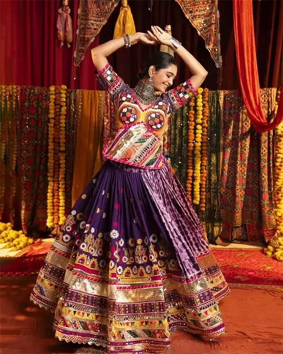 Heavy traditional purple lehenga choli with mirror work for Navratri garba
