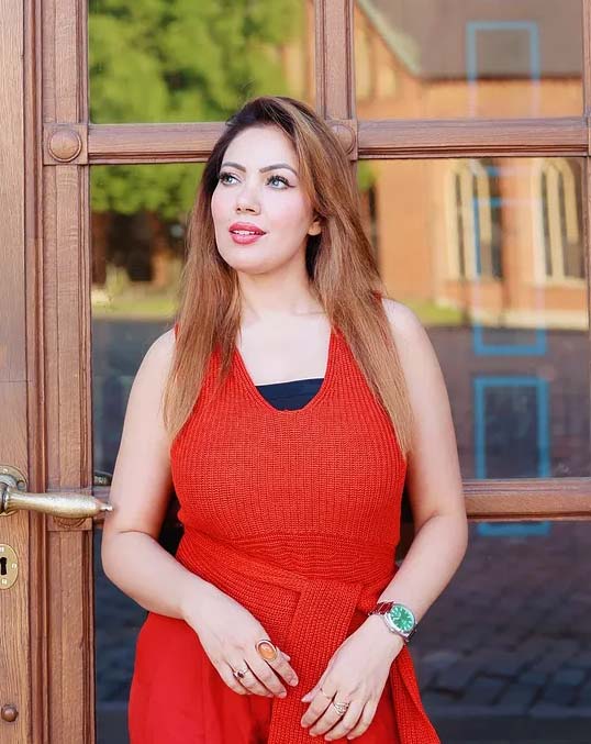 Beautiful Indian bhabhi Munmun Dutta in stylish red outfit posing outdoors – Babita Ji from TMKOC