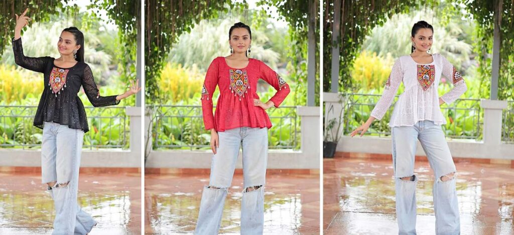 Girl wearing black, maroon, and white embroidered kurti with ripped jeans – Indo-Western Navratri look.