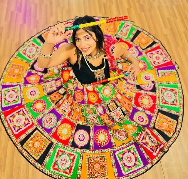 Girl in traditional Navratri Garba lehenga choli with patchwork and jewelry