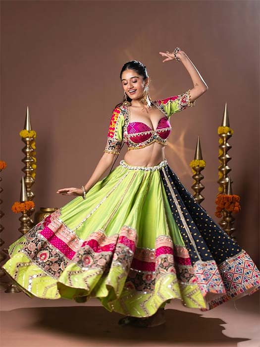 Navratri lehenga for women in lime green with pink blouse and mirror work